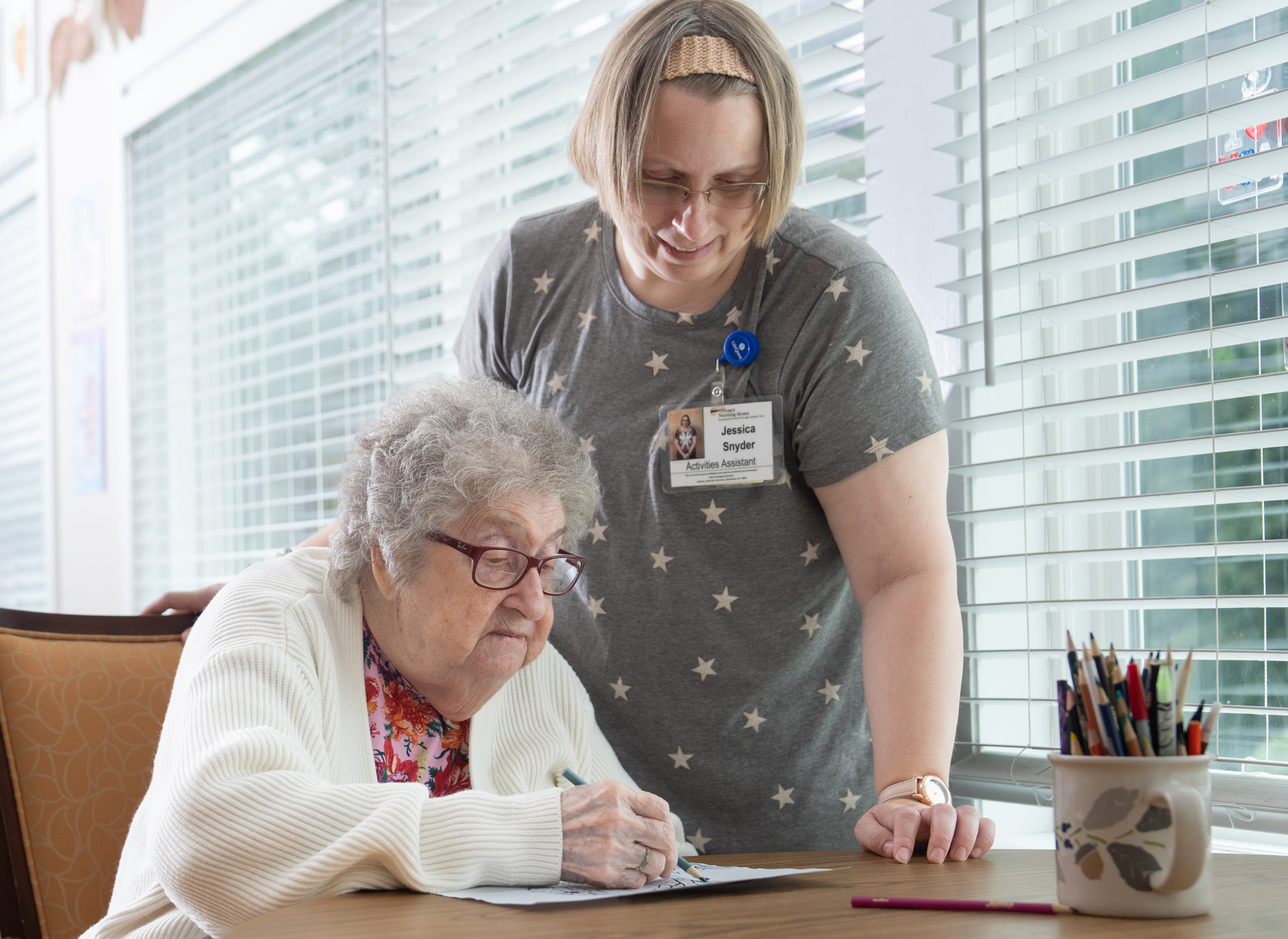 MN_image1 nurse helping patient write